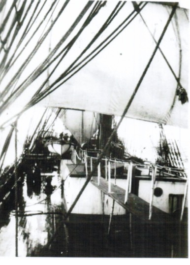 “Bracing in the West winds” (The watch may be seen aft at the Brace winch)