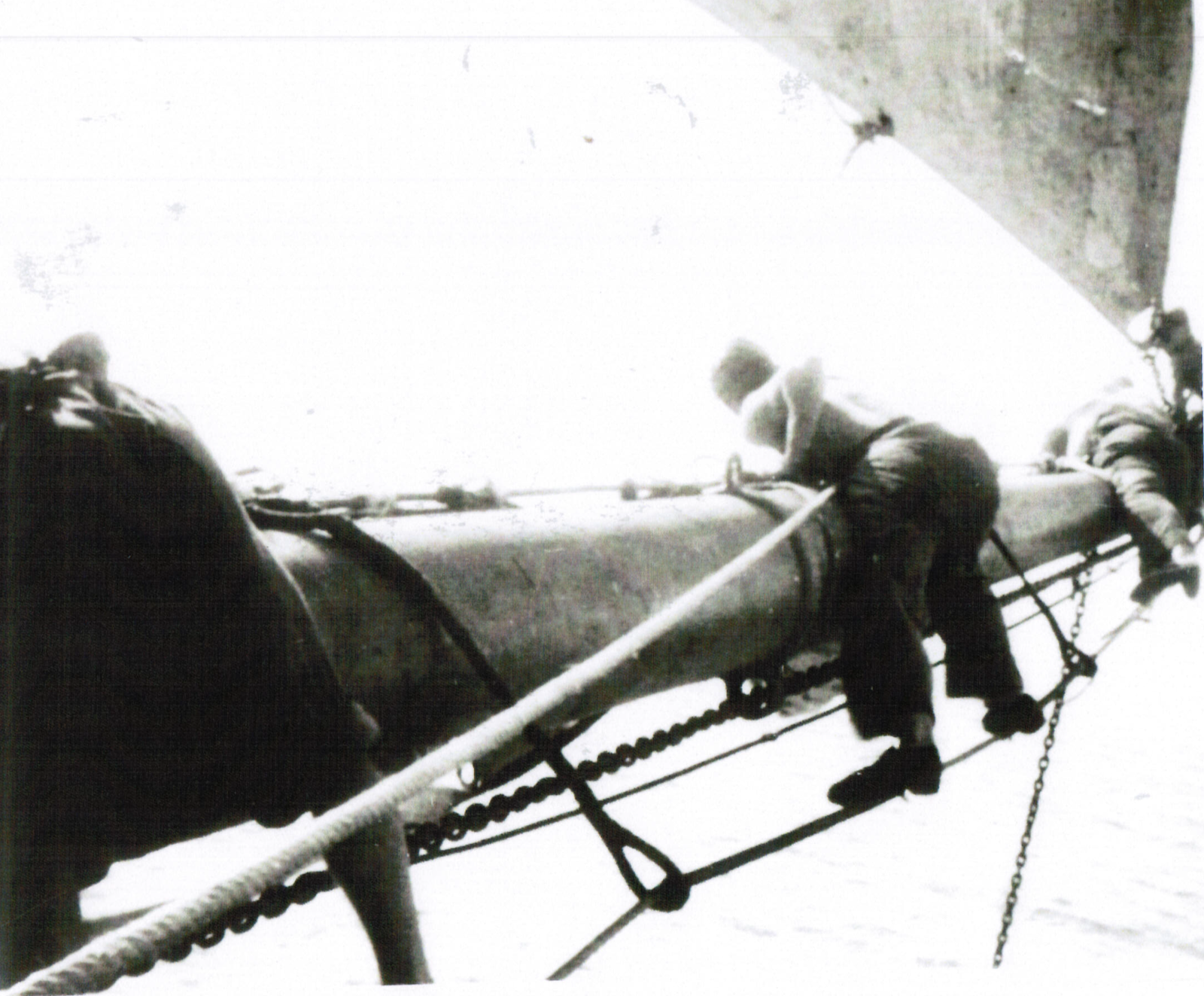 “Changing Sails” The new good sail has been furled and is just going to be sent down. I am just visible on outer end yard arm unshackling sheet.